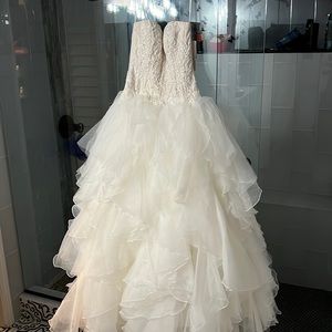 Oleg Cassini strapless wedding gown, gorgeous and new with tags and bag.